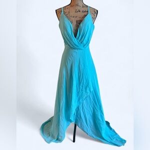 Blue maxi dress with a flowy asymmetrical design & plunge neckline size 4-6